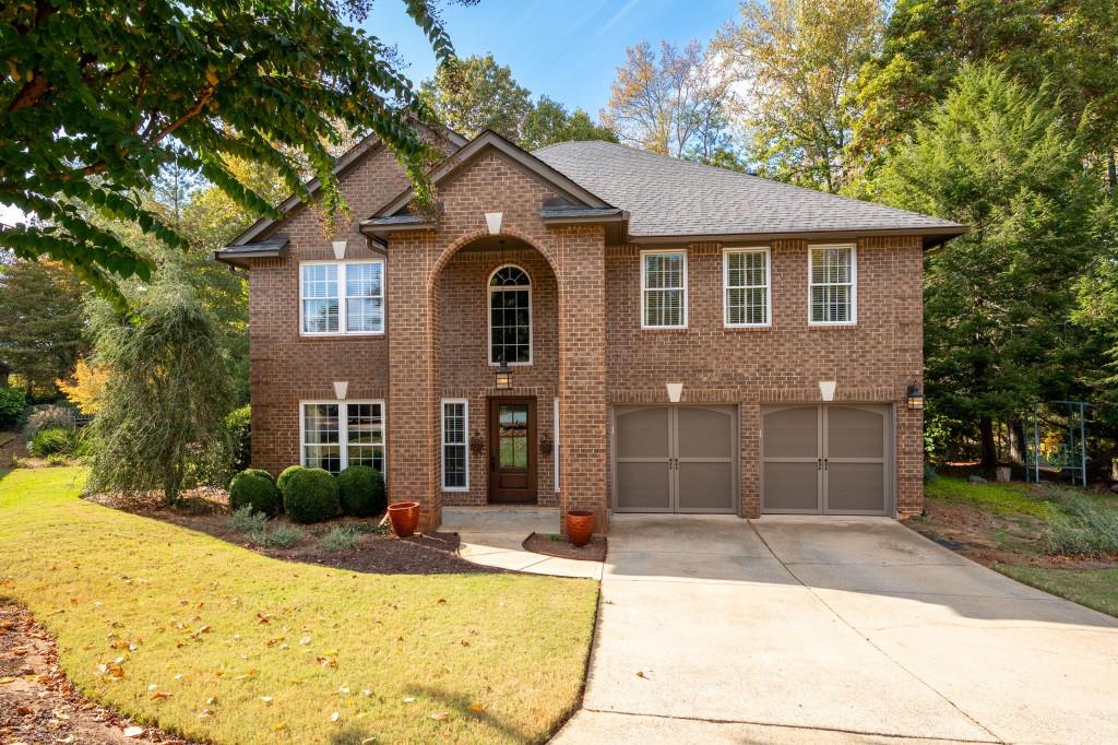 a front view of a house with a yard