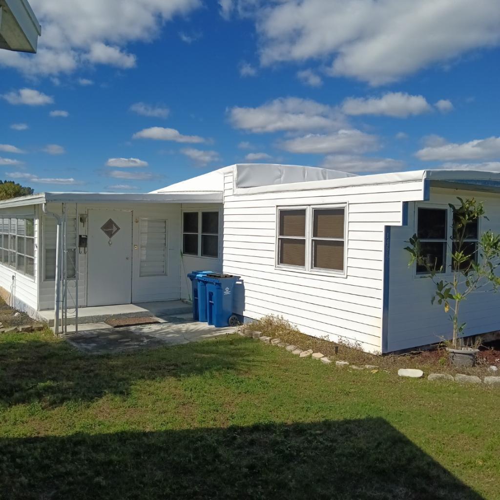 a view of a backyard of the house