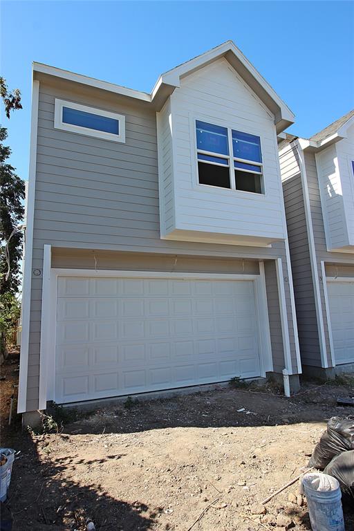 a view of house with backyard space