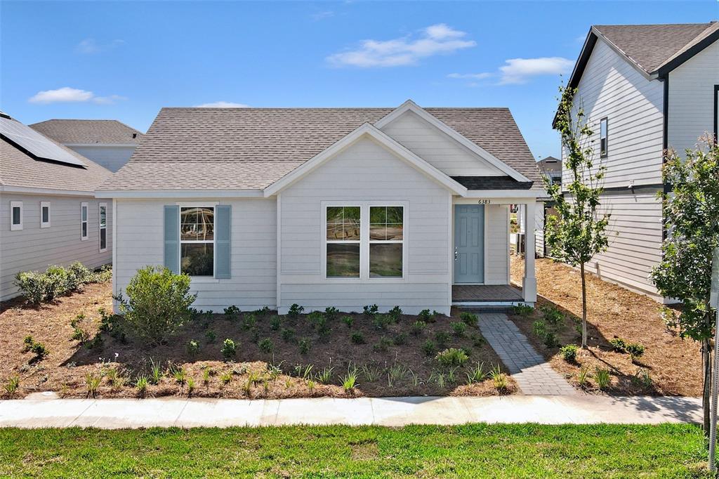 front view of a house with a yard