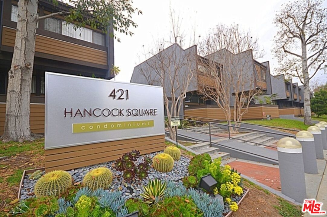 a view of a swimming pool with an outdoor seating