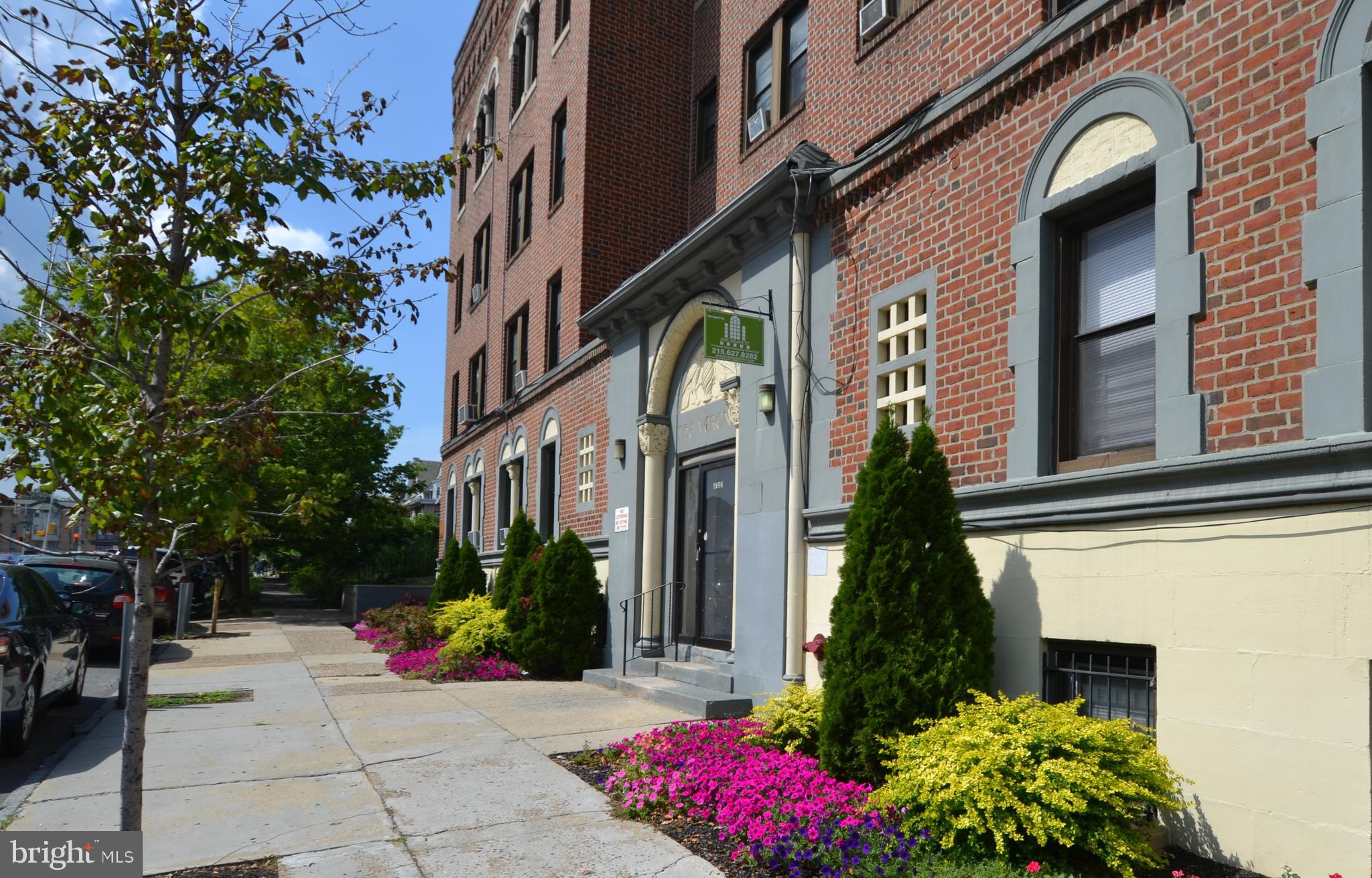 a view of a building with flower plants