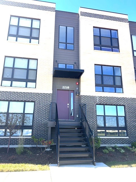 a view of entryway with a front door