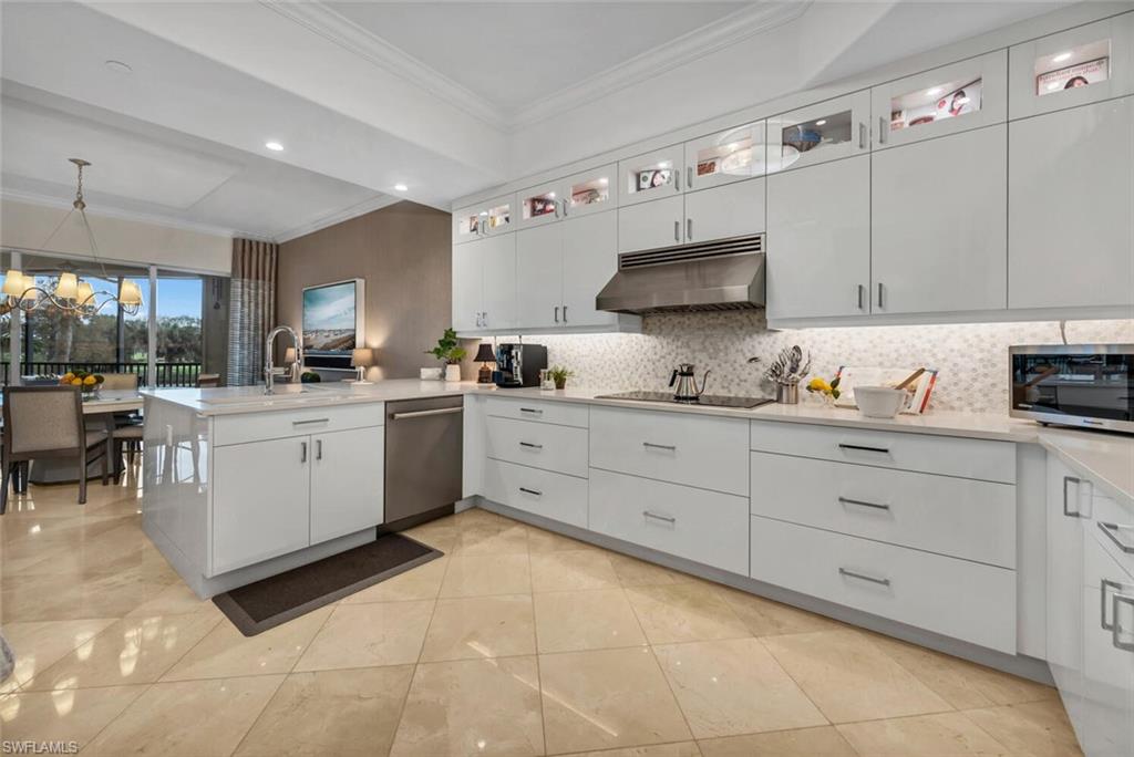 a kitchen with cabinets and window