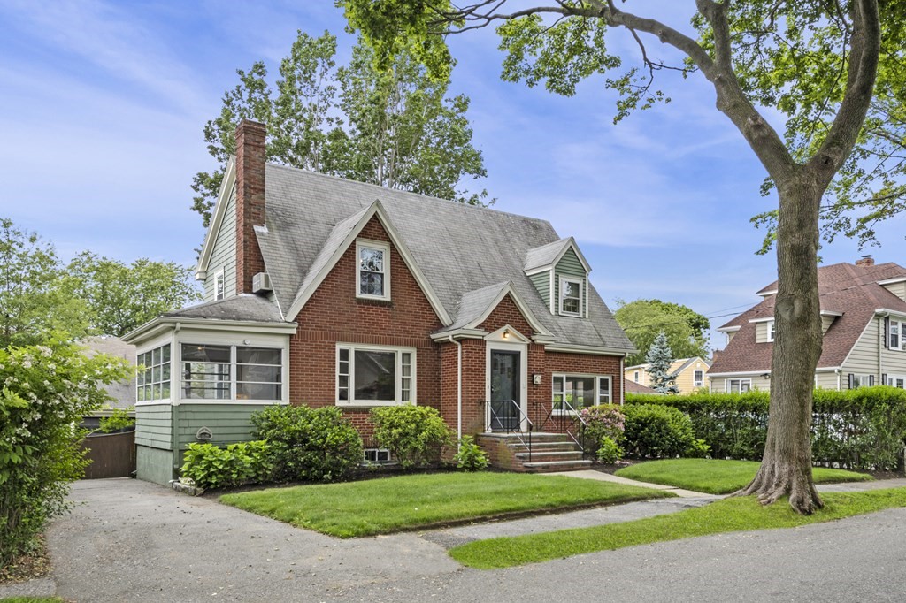 front view of a house with a yard