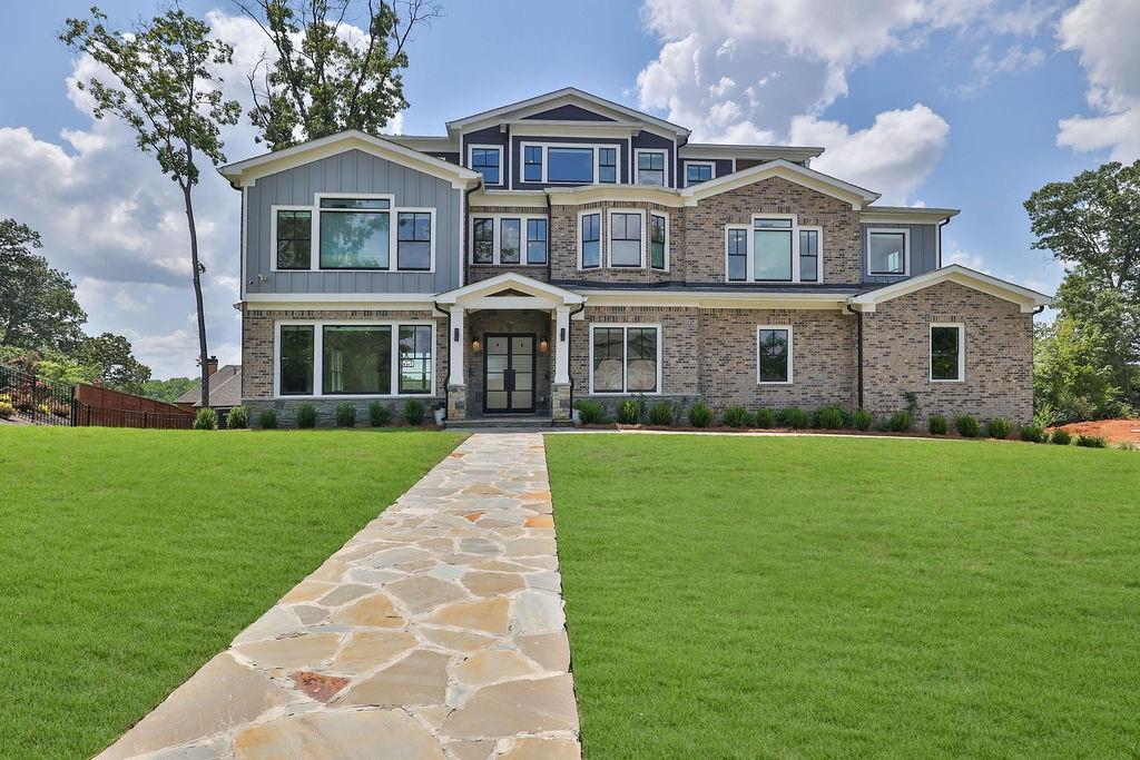 a front view of a house with a yard