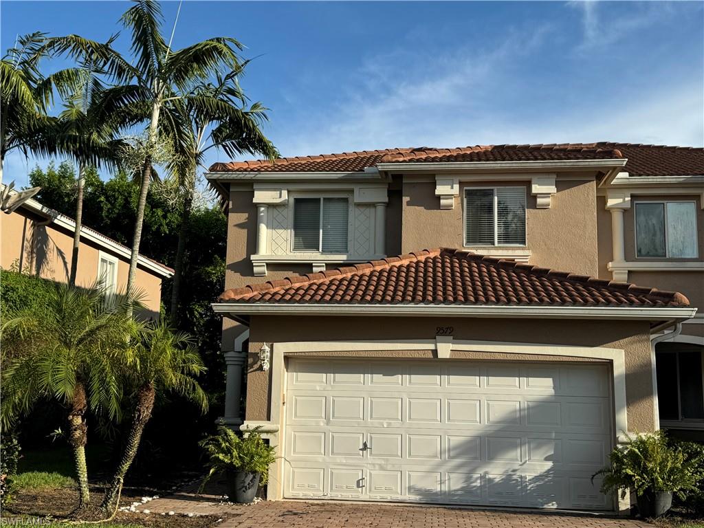 a front view of a house with a garage