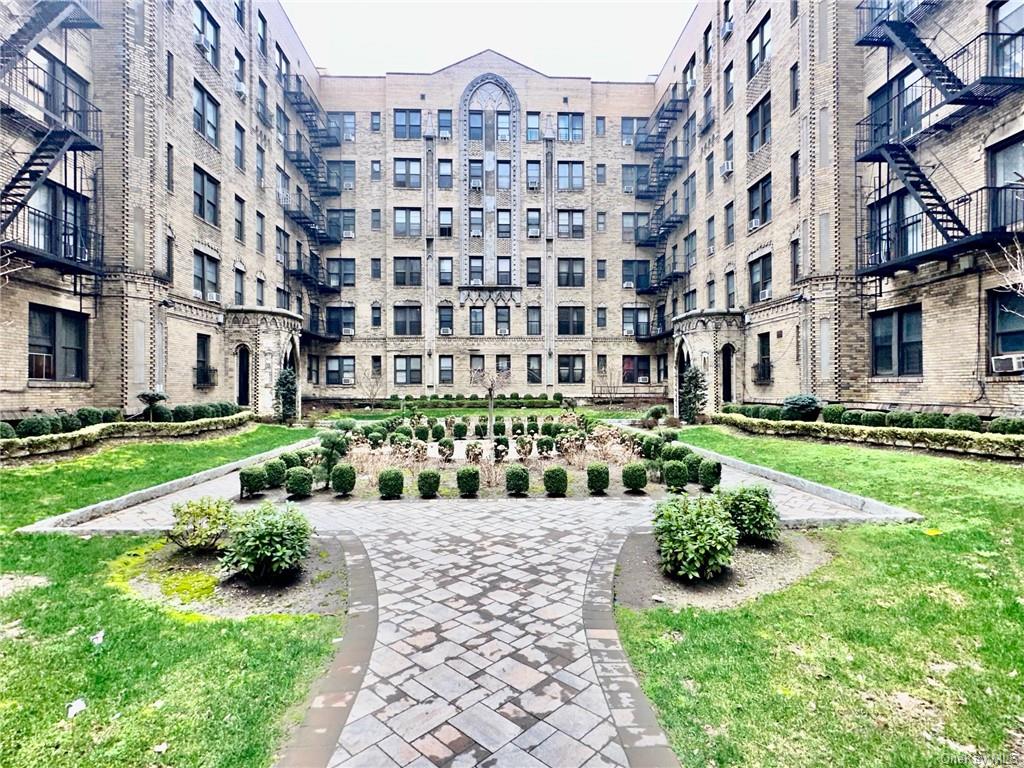 a view of a garden with a chair and big yard