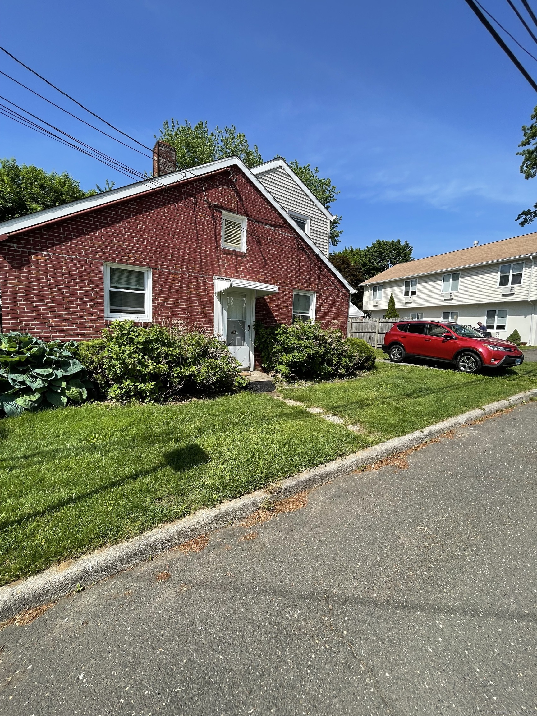 a front view of a house with a yard