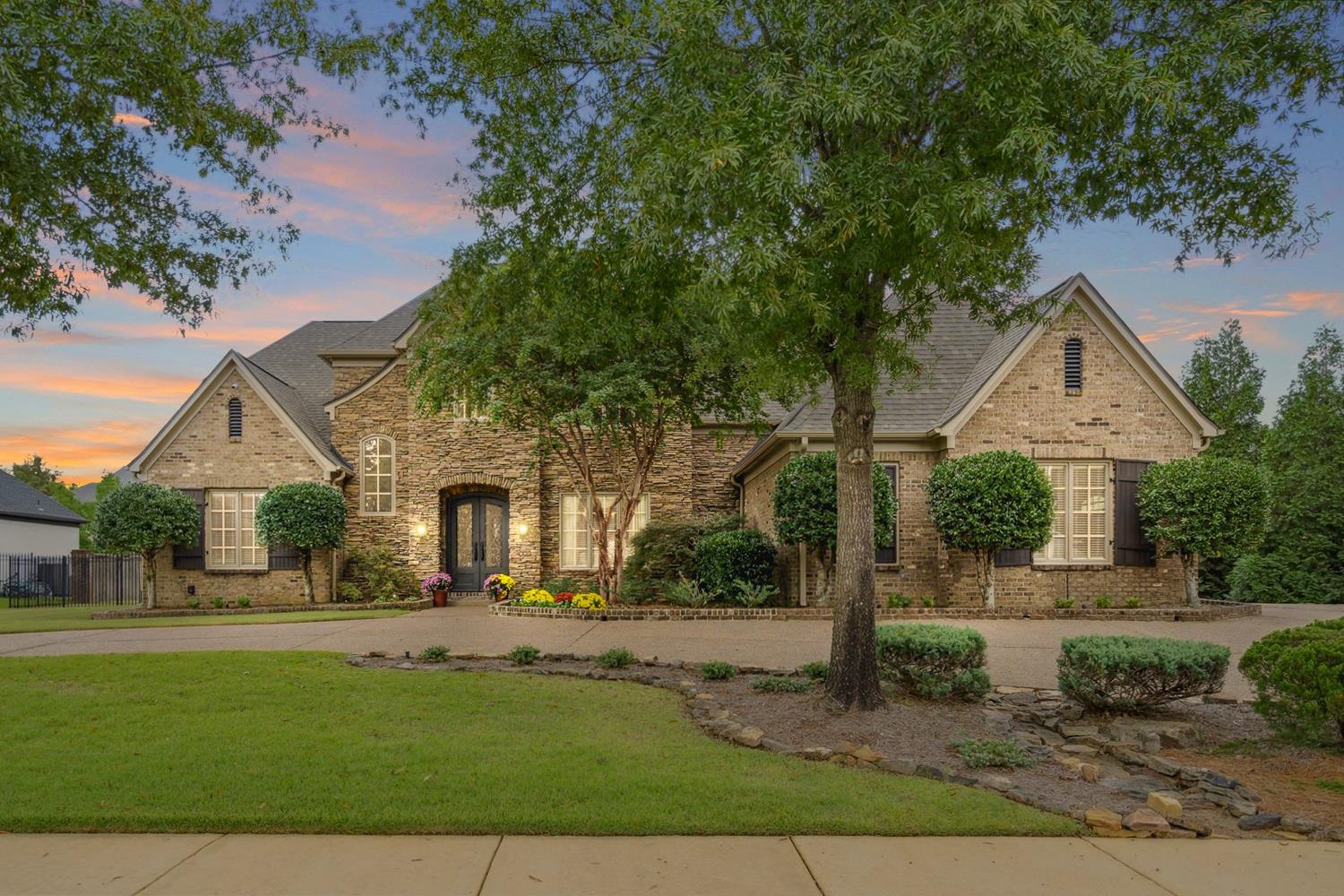 a front view of a house with a yard