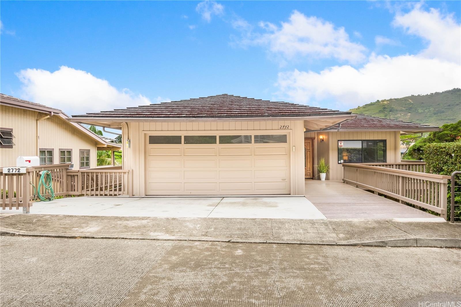 a front view of a house with a garage