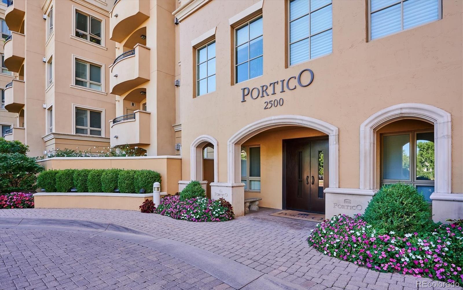 a view of a building with potted plants