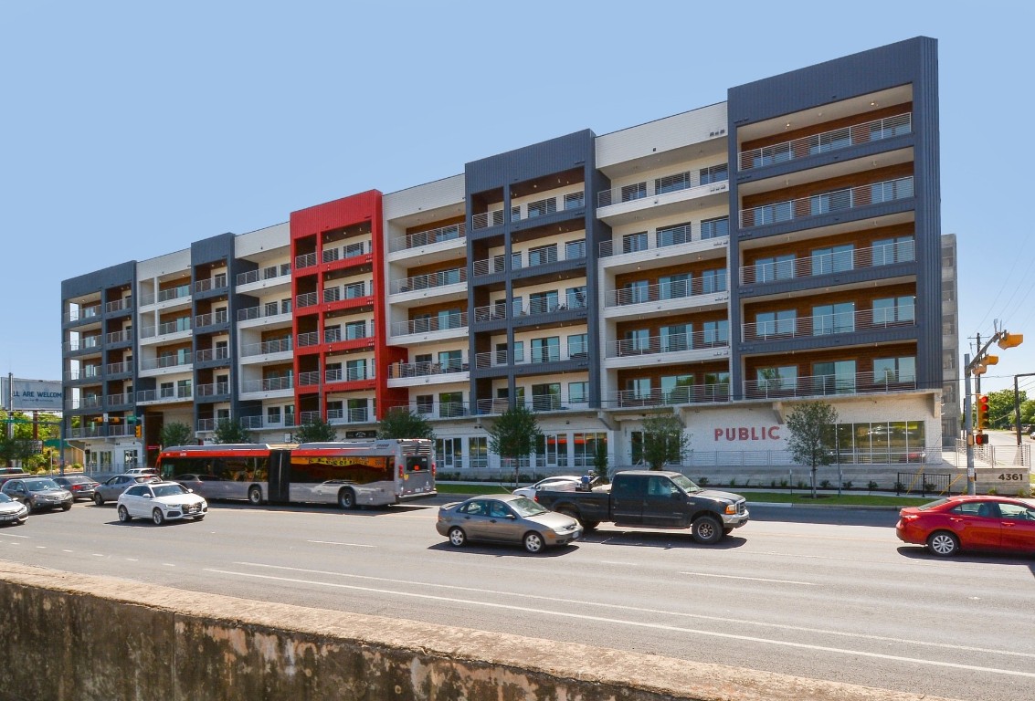 a view of a cars parked in front of a building