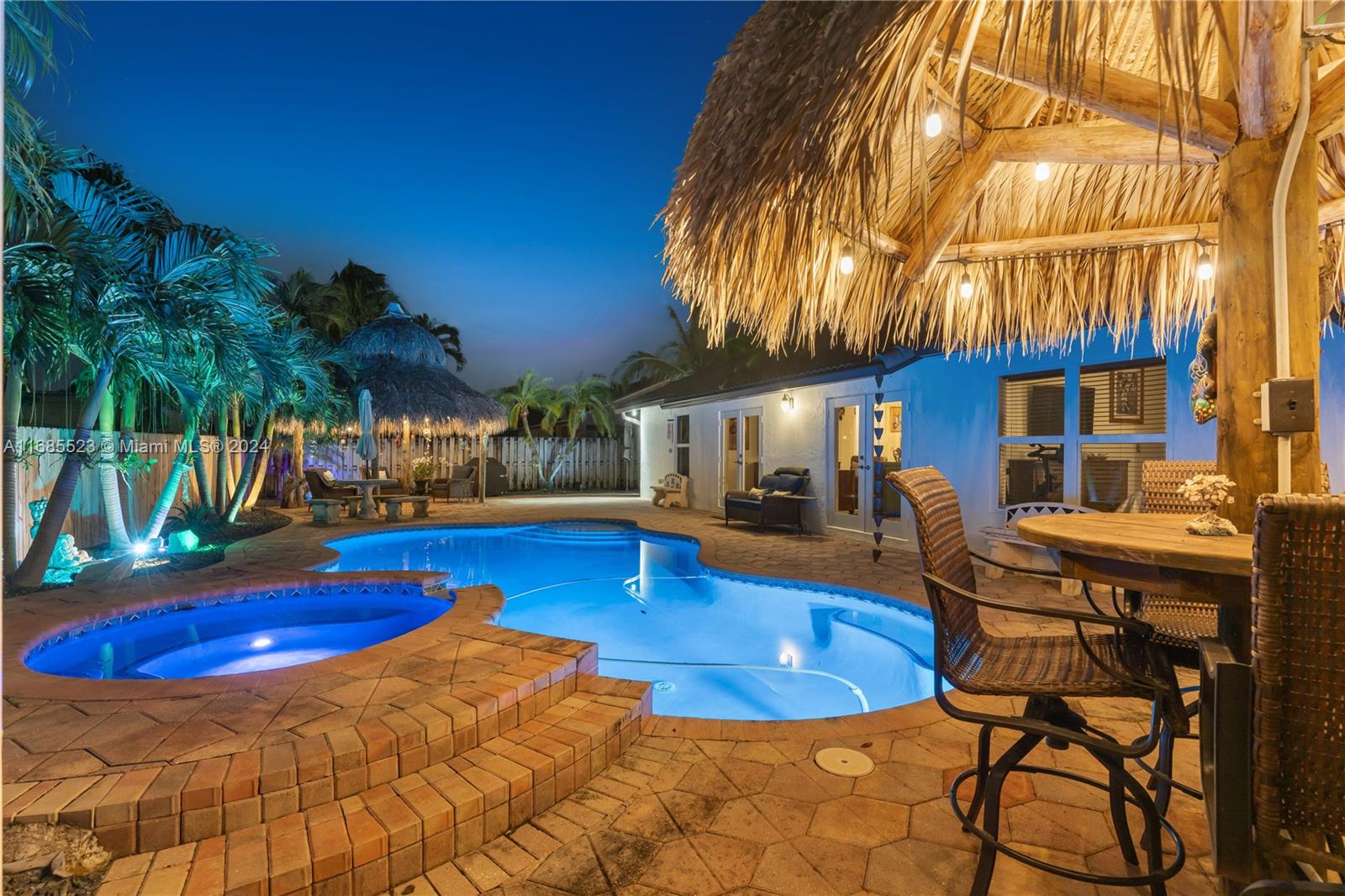 a view of swimming pool with outdoor seating