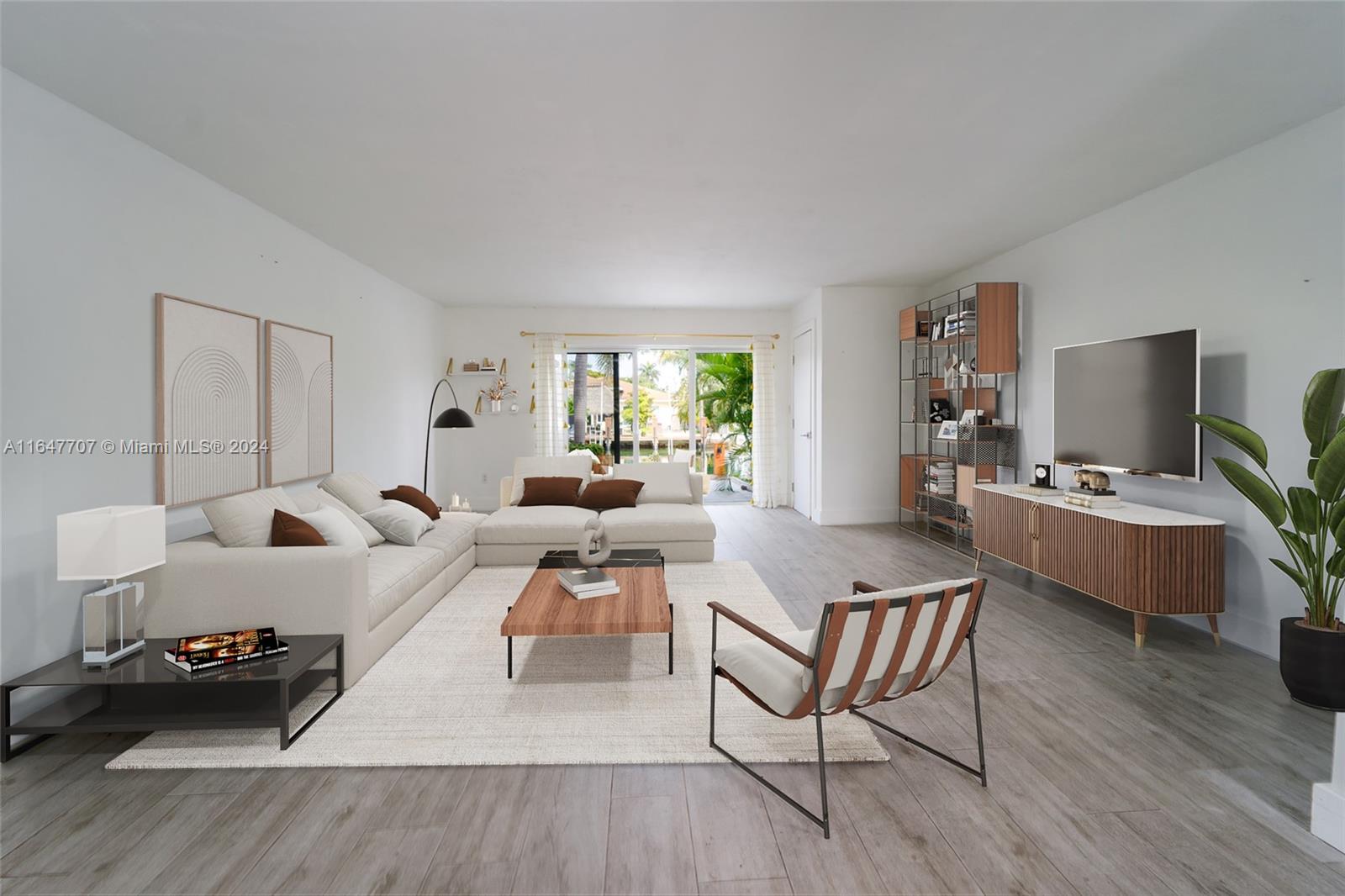 a living room with furniture window and wooden floor