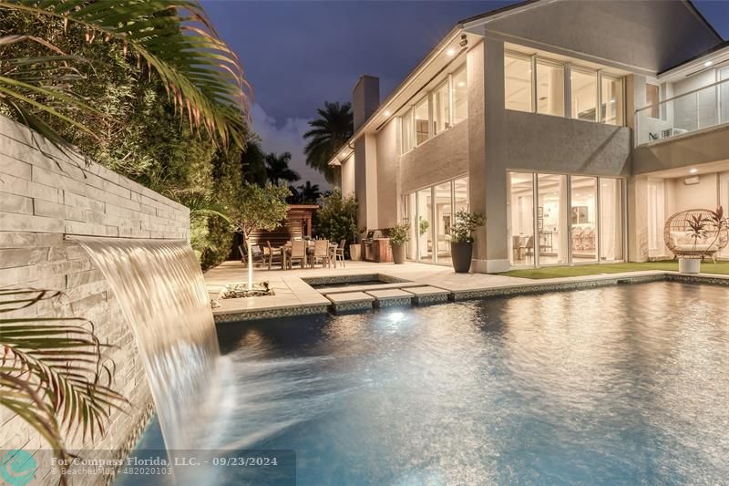 a view of swimming pool with outdoor seating