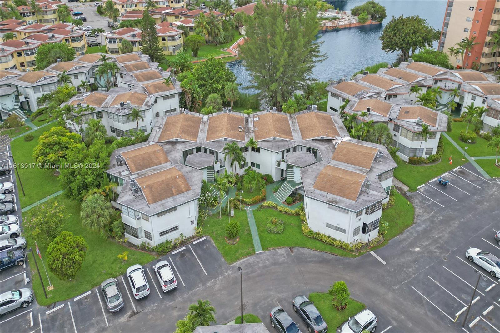 an aerial view of a house with garden space and street view