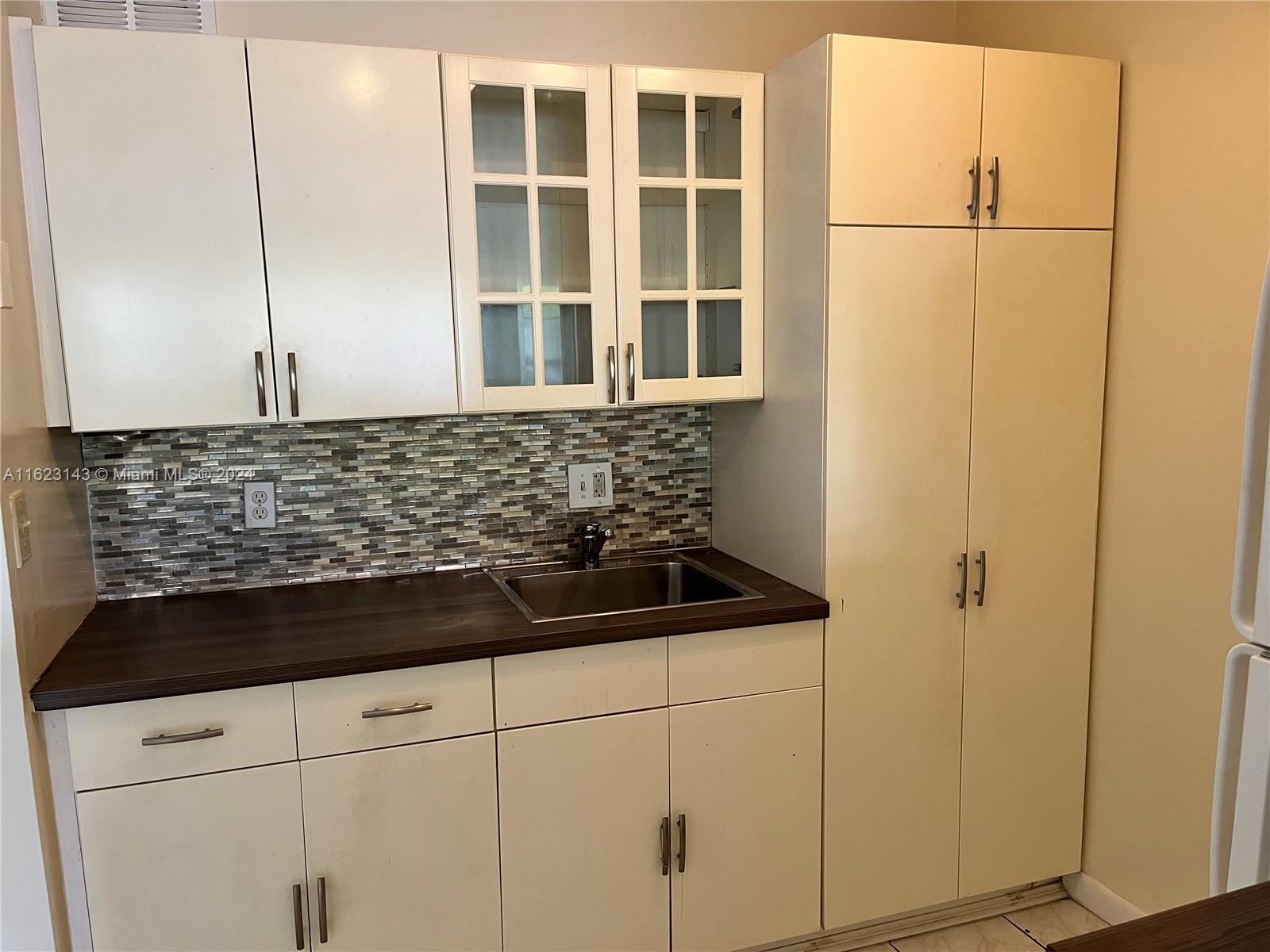 a view of a refrigerator in the kitchen