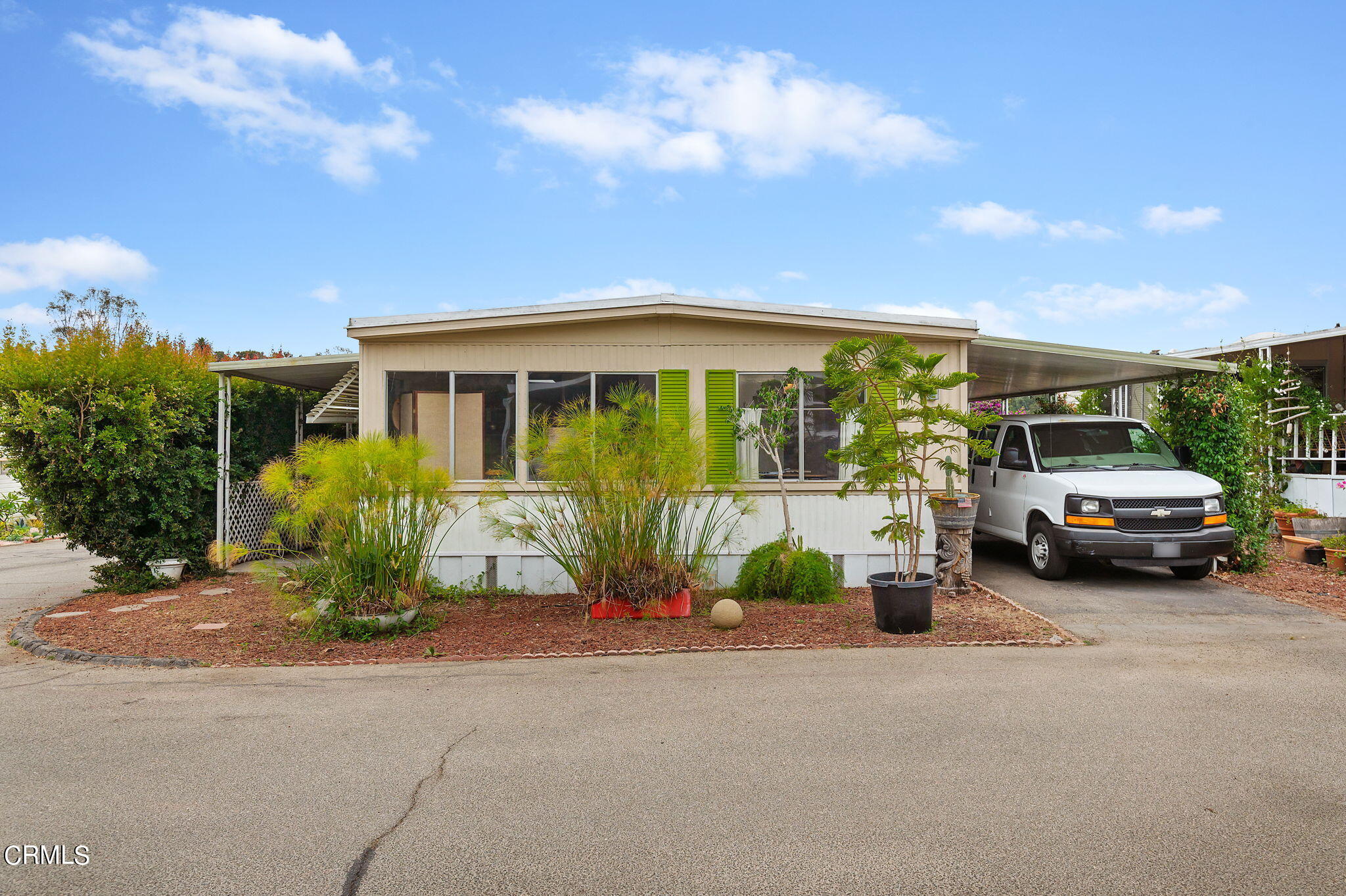 a view of a car parked in front of a house