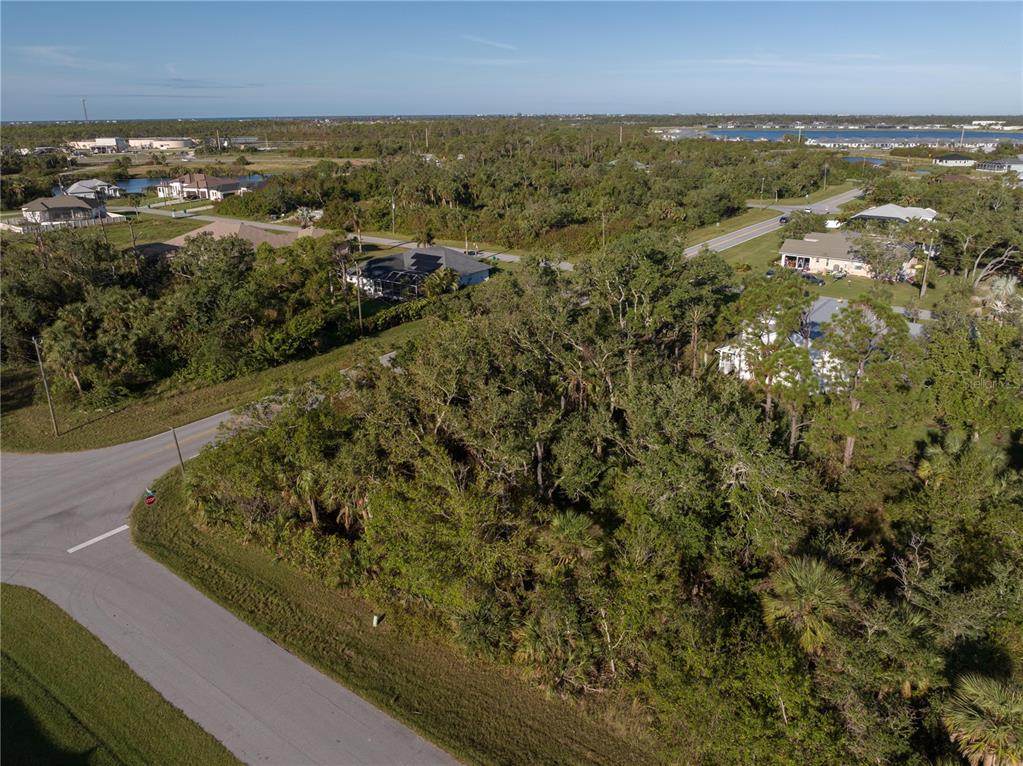 an aerial view of a houses with a yard