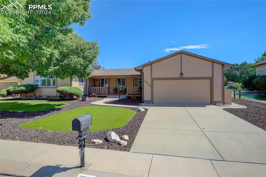 Beautifully landscaped front yard, oversized 2-car garage and covered front porch.