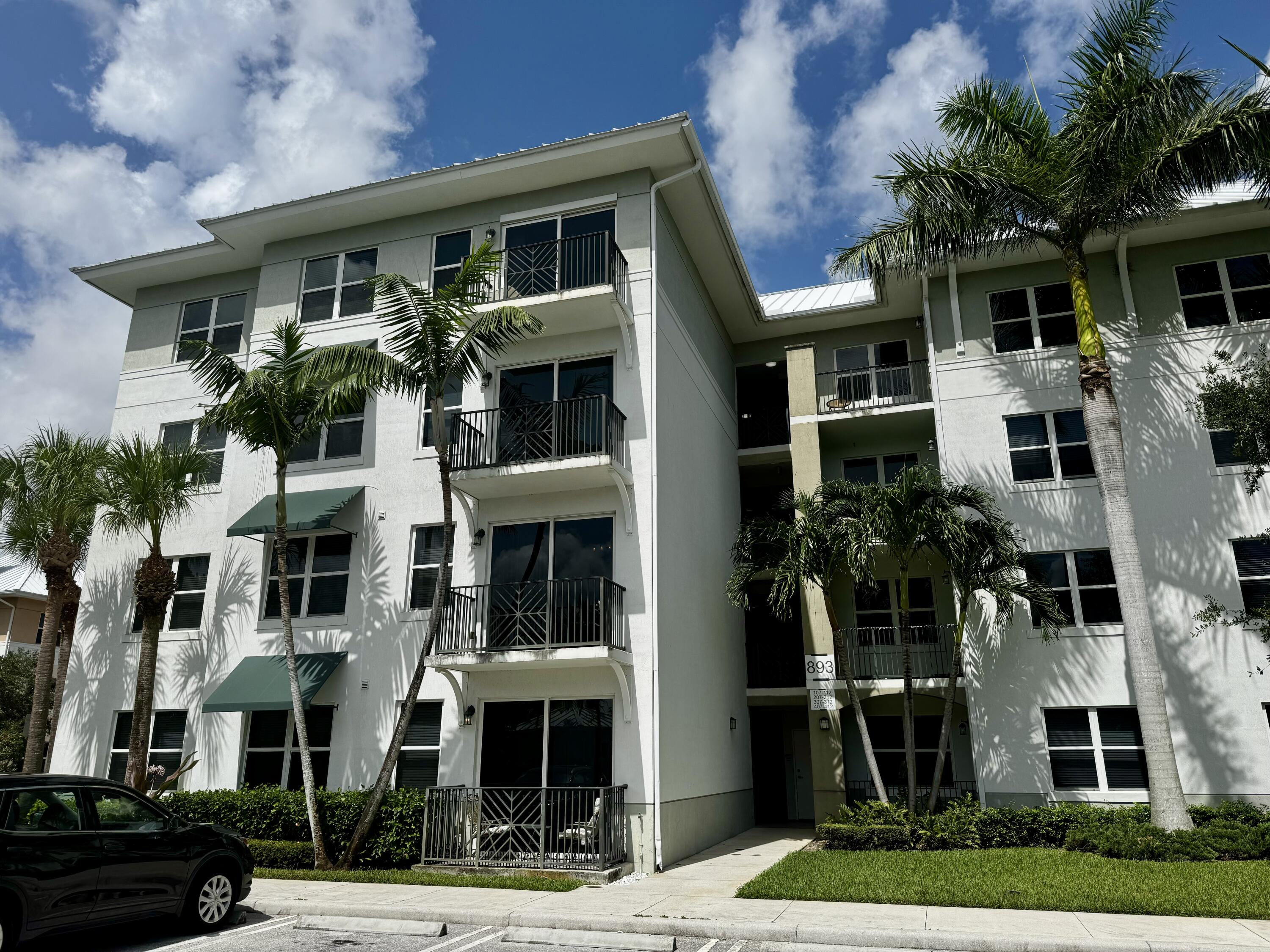 a front view of residential houses with yard