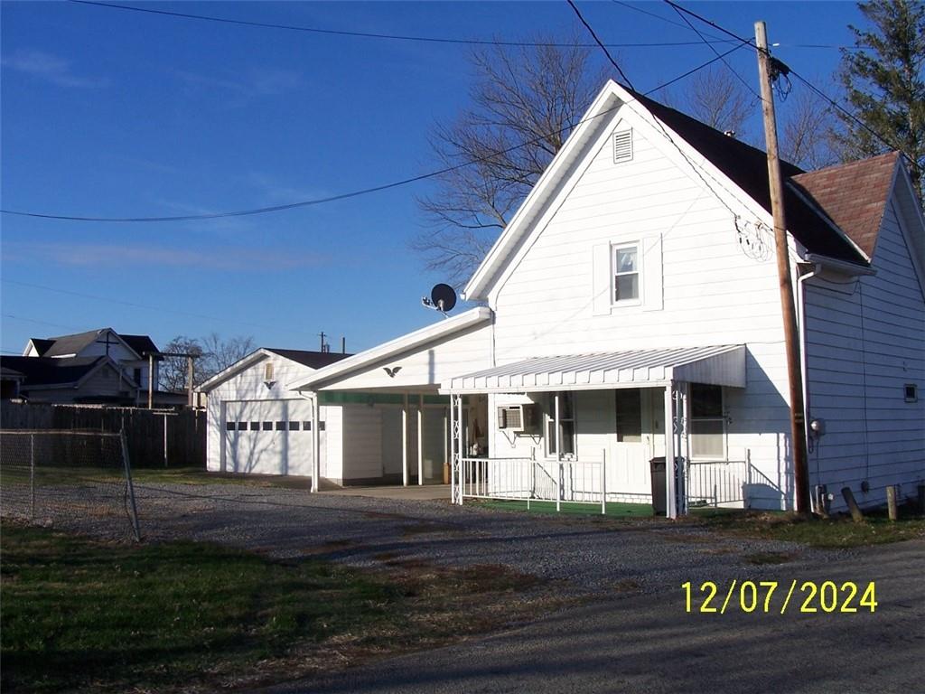 a view of house with yard