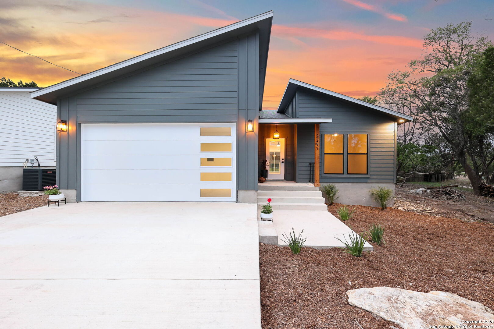 a front view of a house with yard