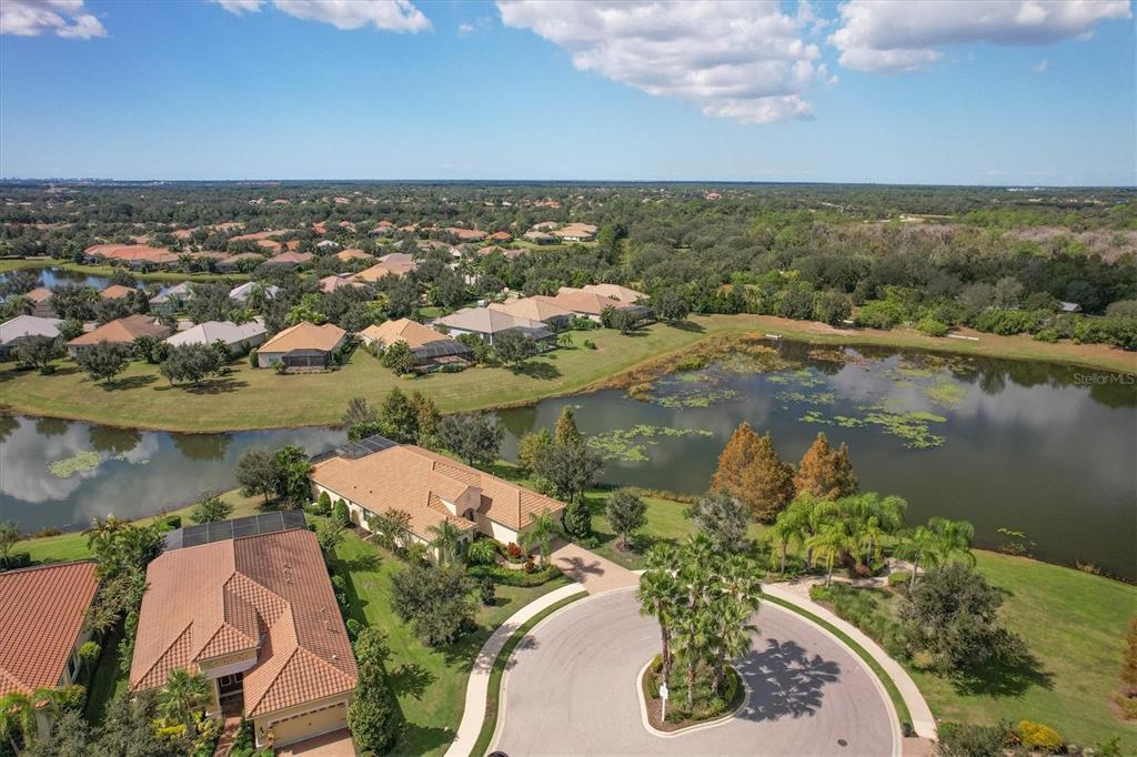 an aerial view of a house with a lake view