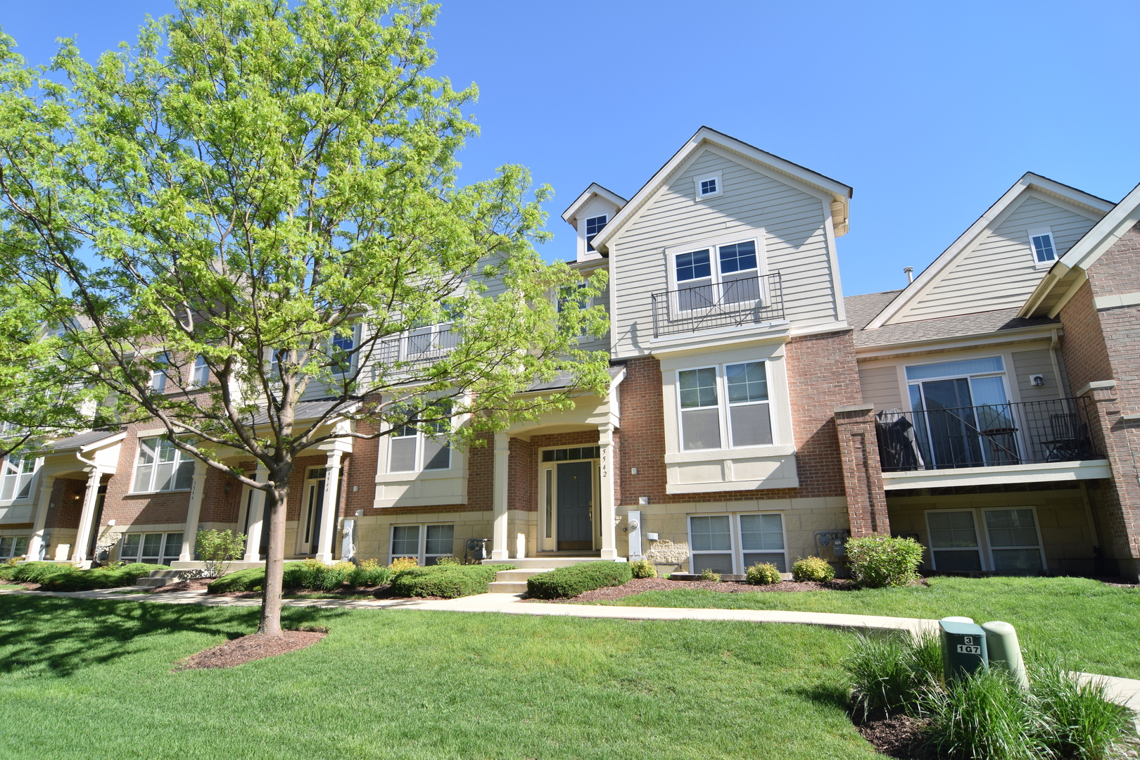 front view of a house with a yard