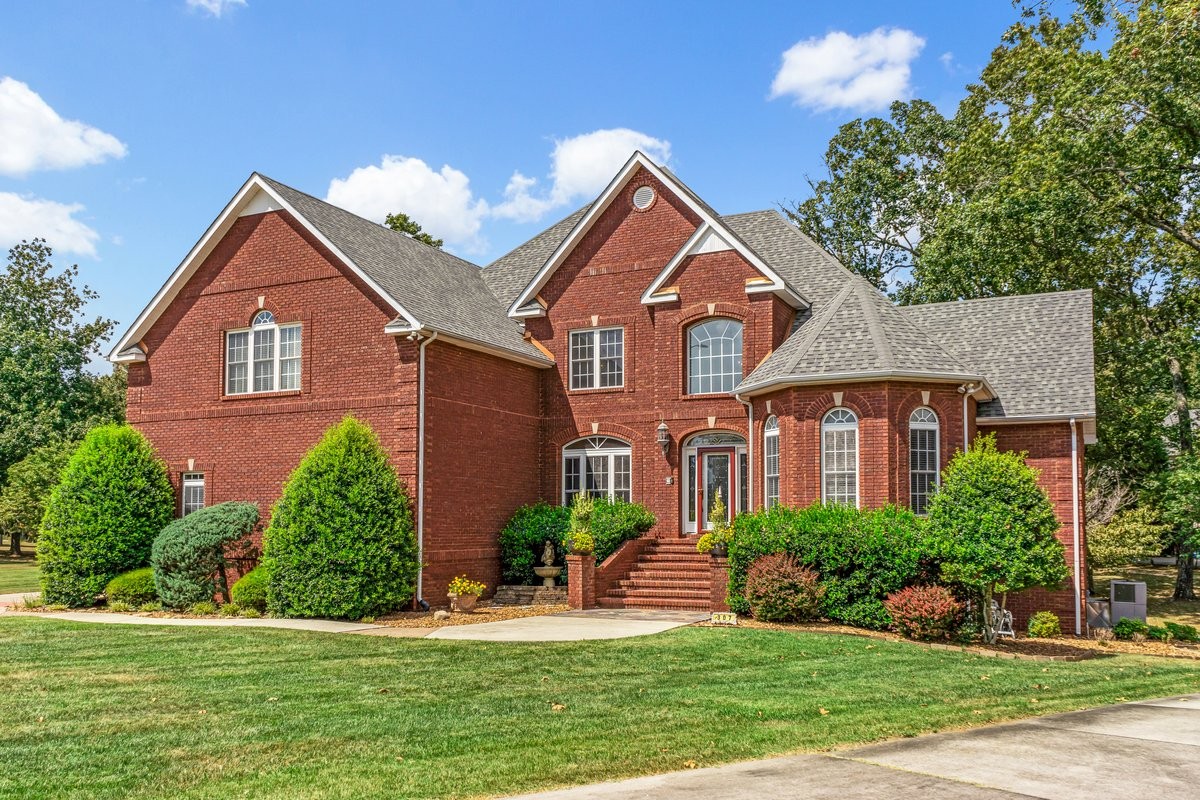 a front view of a house with a yard