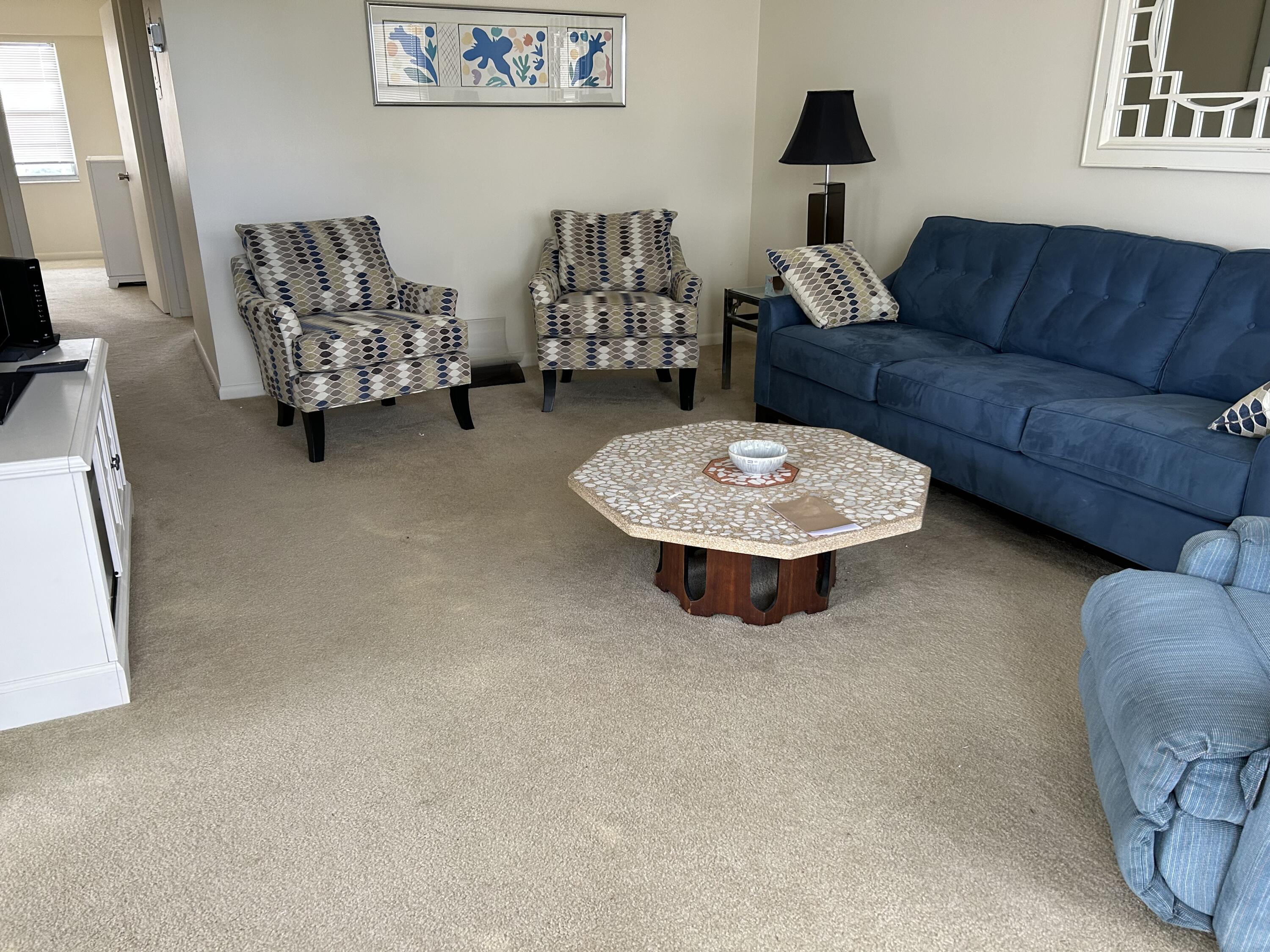 a living room with furniture and a couch