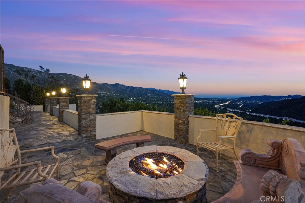 a view of a swimming pool with a patio and a yard