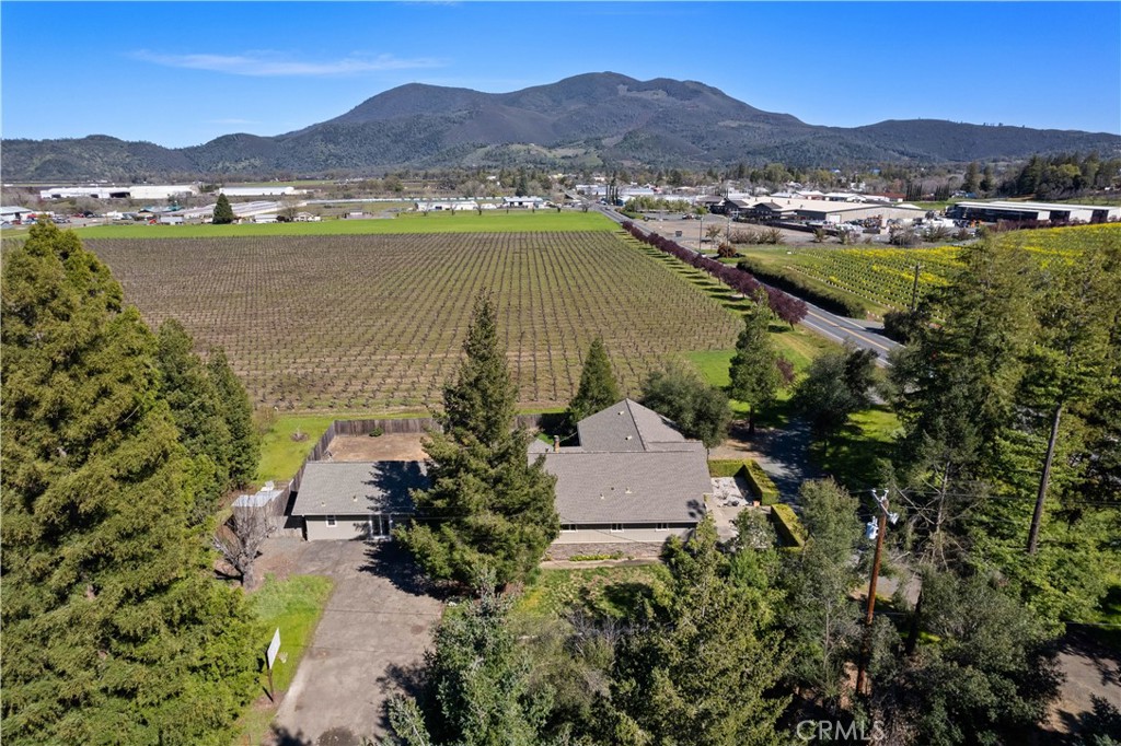 an aerial view of residential house with outdoor space and lake view