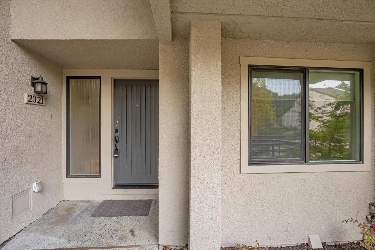 a view of a door and a window