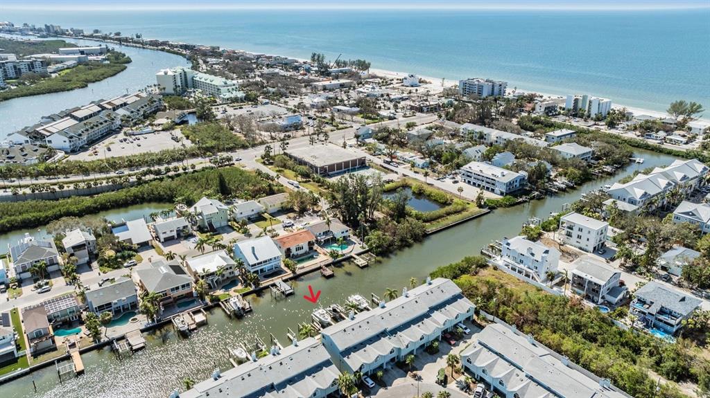 an aerial view of a city with ocean view