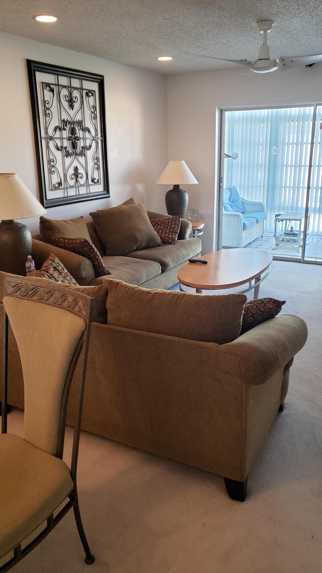 a living room with furniture and window