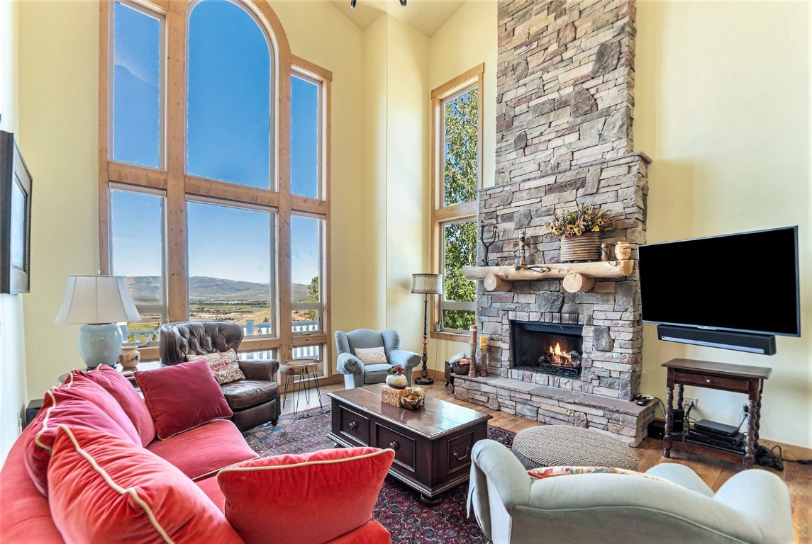 a living room with furniture fireplace and a flat screen tv