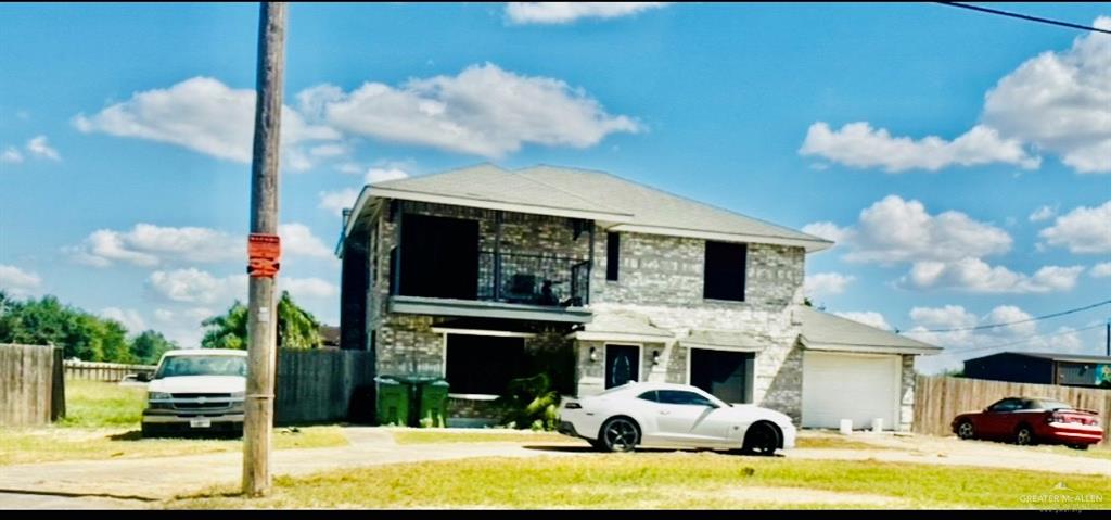 a view of a car parked in front of house