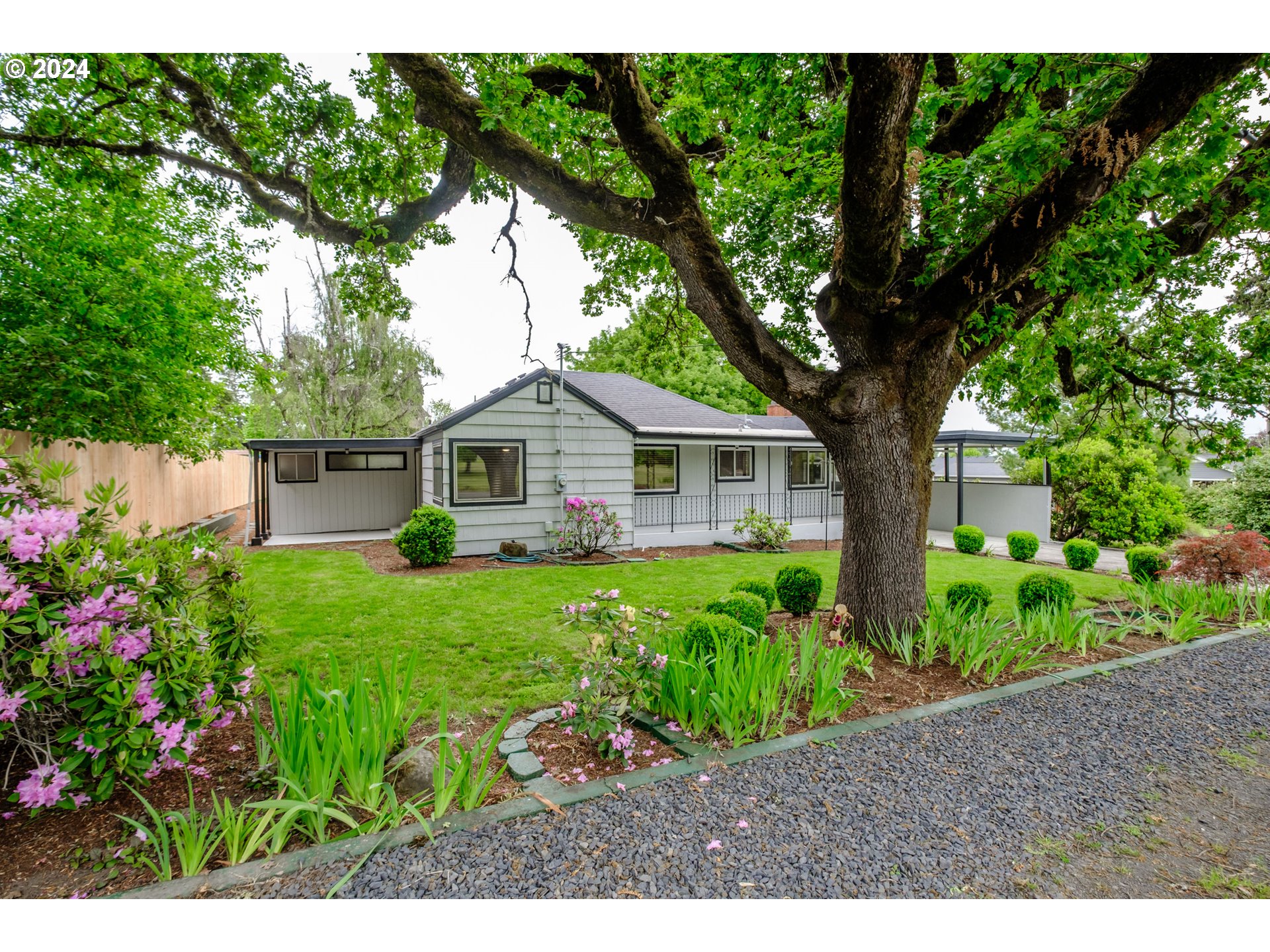 a front view of a house with garden