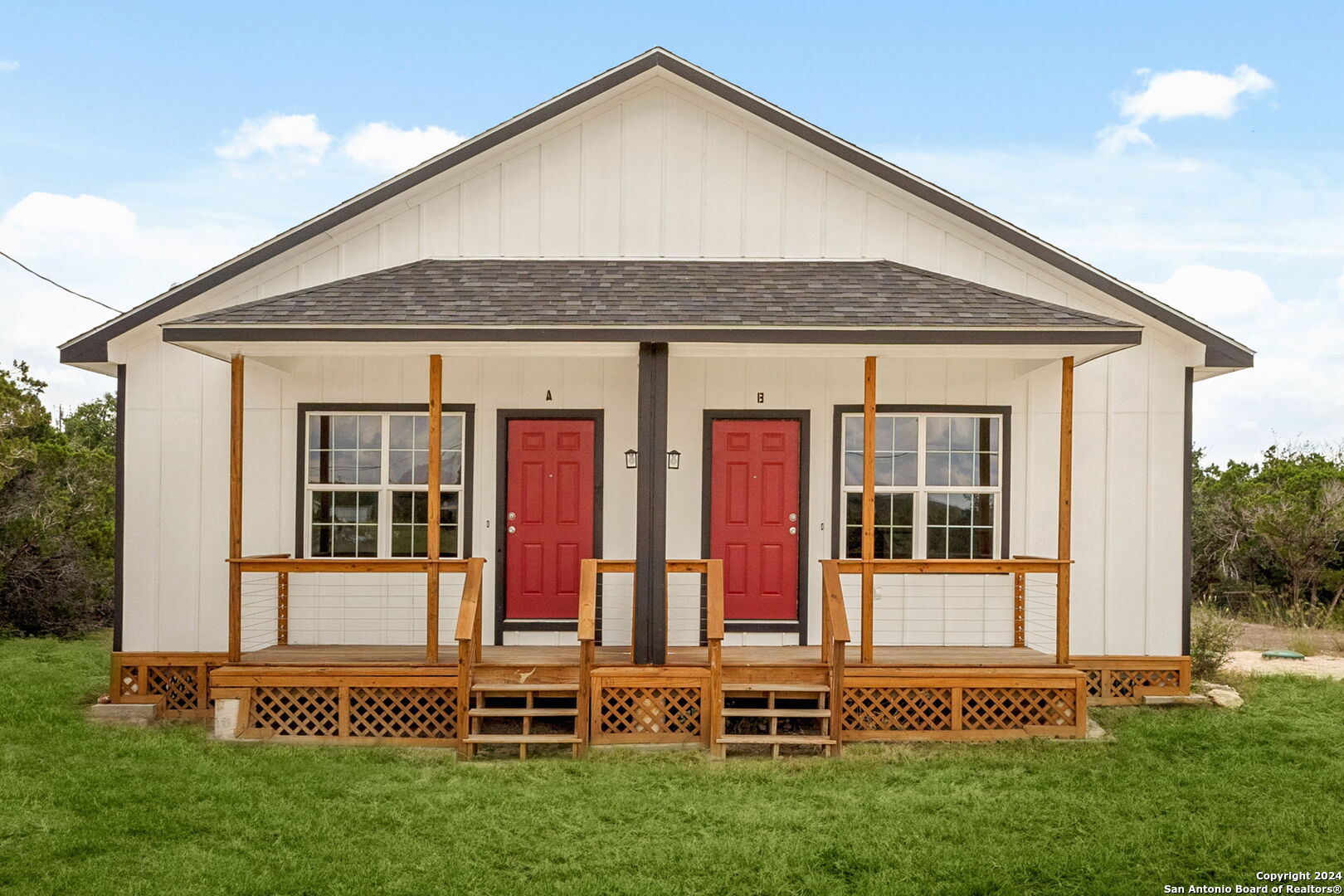 front view of a house with a yard