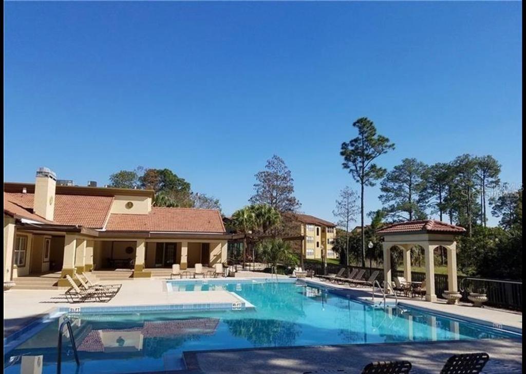 a view of a house with backyard porch and patio