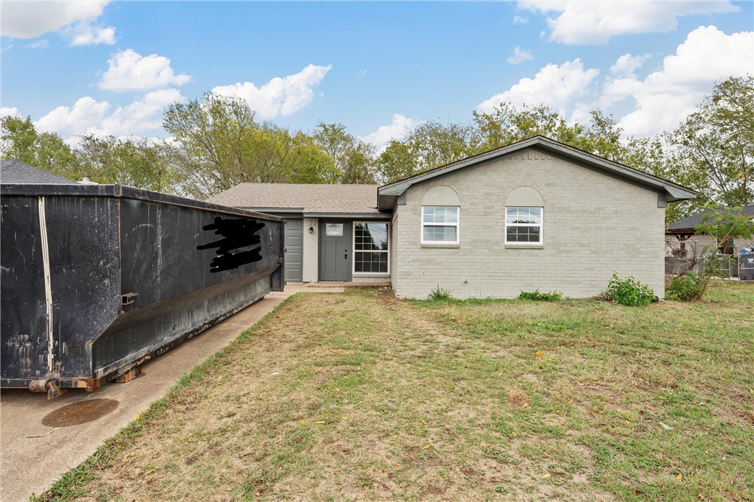 a house view with a backyard space