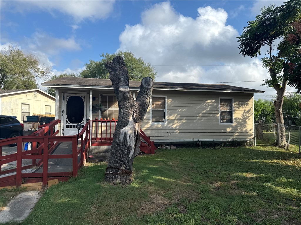 a front view of house with yard and outdoor seating