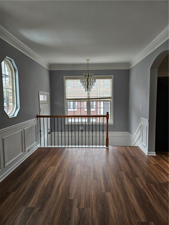 view of a room with wooden floor and windows