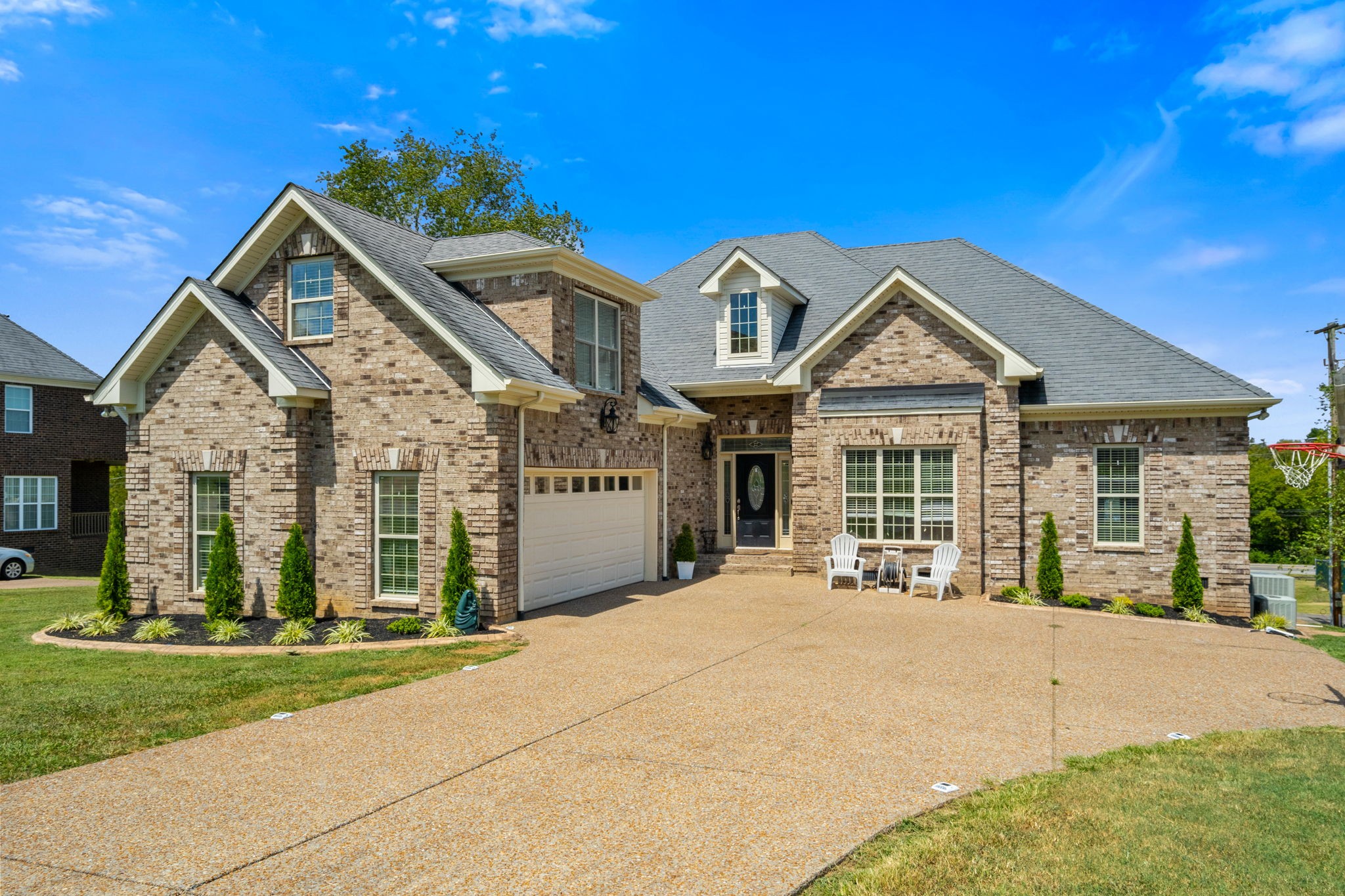 a front view of a house with a yard