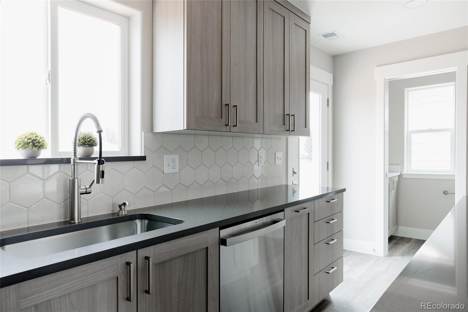 a kitchen with a sink and cabinets