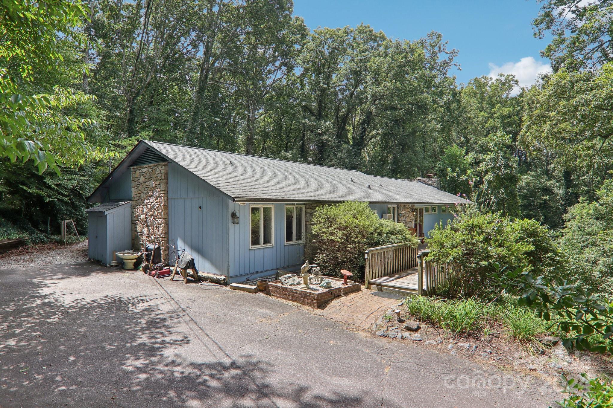 a wooden bench sitting in front of a house