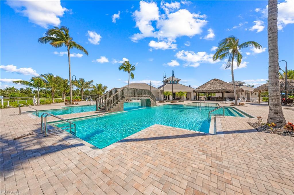 a view of a swimming pool with a yard