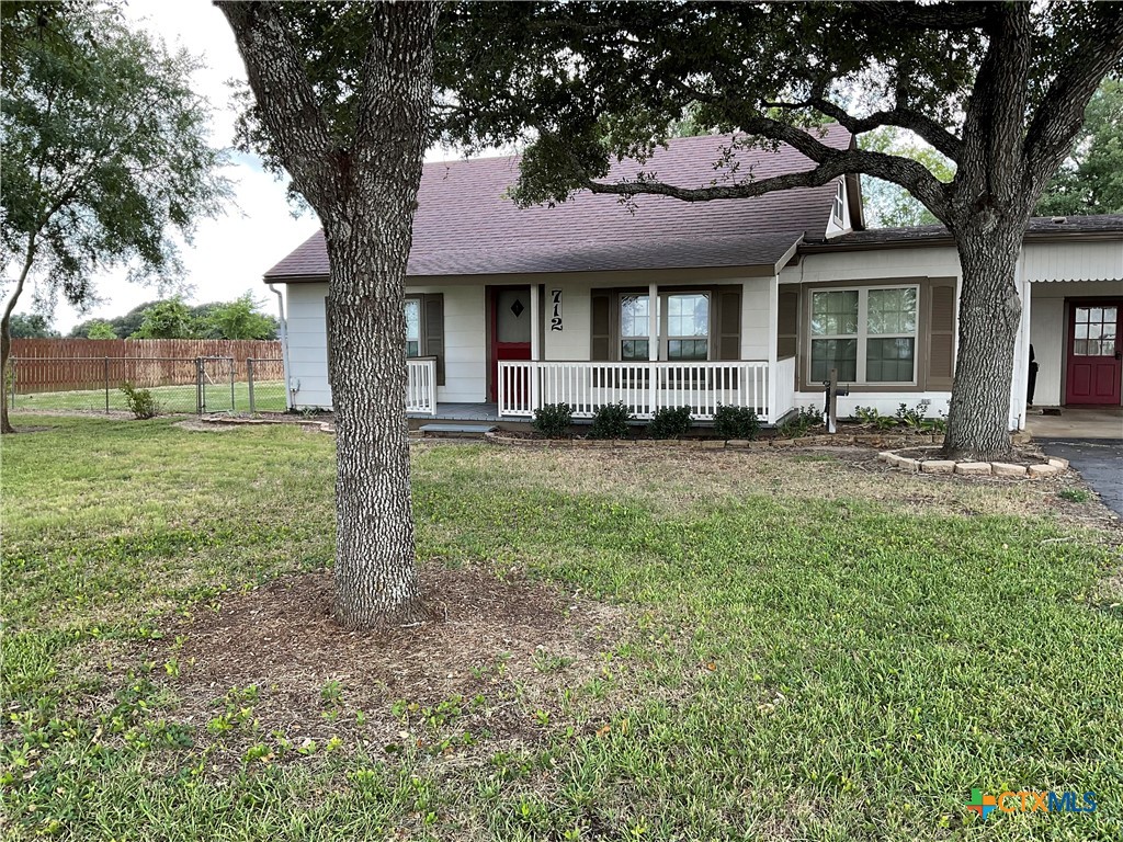 a view of a house with a yard